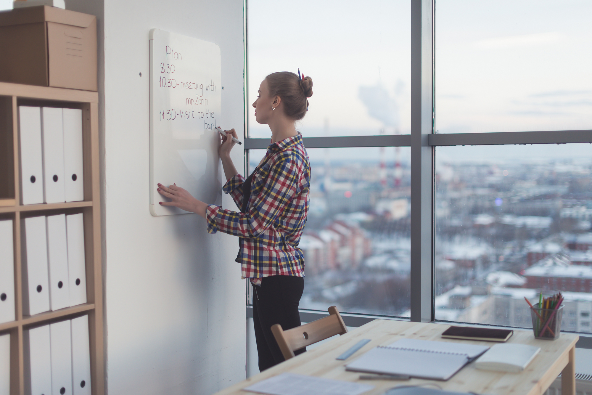 Businesswoman writing day plan