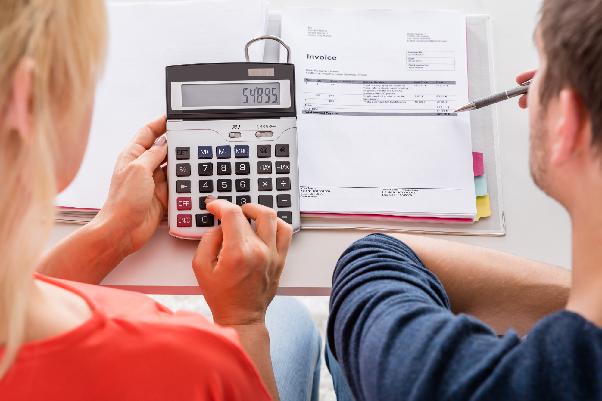 Couple Using Calculator