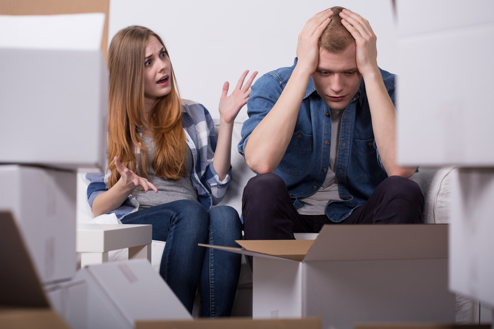 Irate worried couple and quarrel during packing