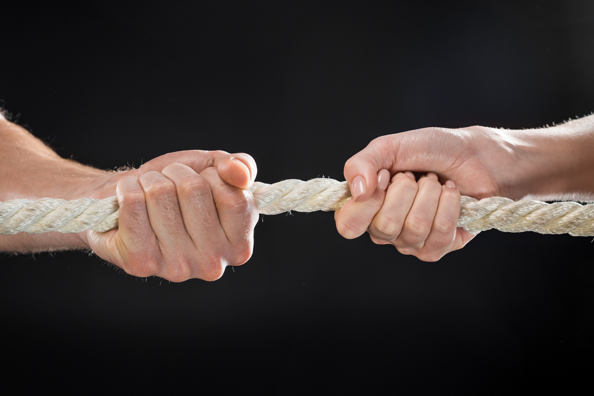 Man and woman pulling rope